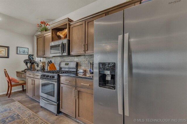 3838 E 144th St S, Bixby, OK 74008 - kitchen with stainless steel appliances, decorative backsplash, dark countertops, and open shelves