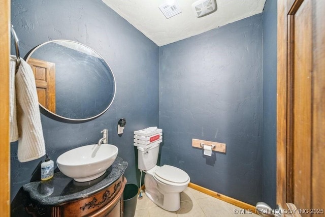 bathroom with visible vents, baseboards, toilet, tile patterned flooring, and vanity