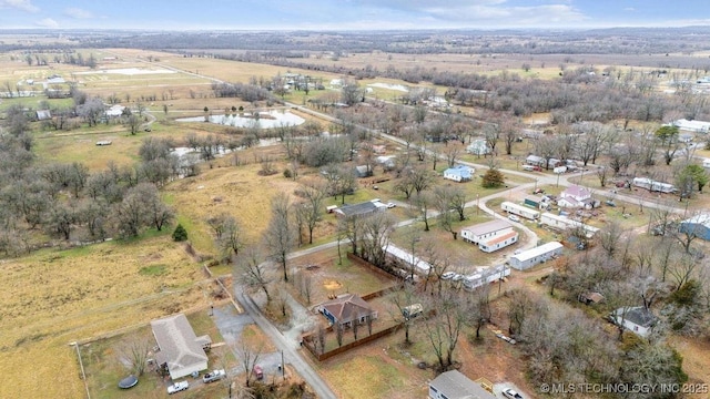 birds eye view of property with a rural view