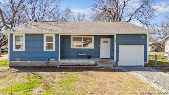 ranch-style house featuring roof with shingles, covered porch, an attached garage, crawl space, and fence