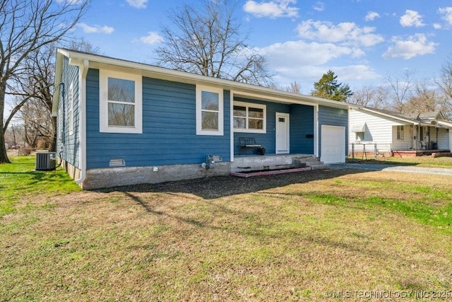 view of front of home featuring central AC unit, a porch, an attached garage, driveway, and a front yard