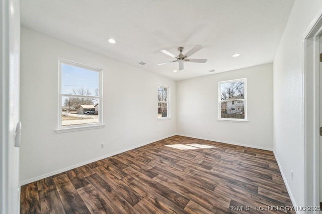 unfurnished room with dark wood-style flooring, ceiling fan, recessed lighting, and baseboards