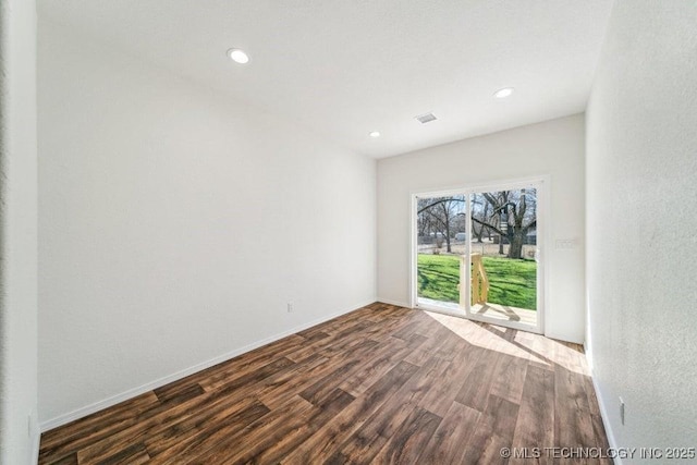 517 W Clyde Ave, Vinita, OK 74301 - spare room featuring dark wood finished floors, baseboards, and recessed lighting