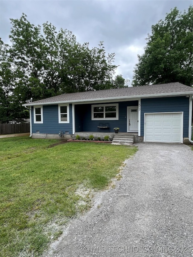 517 W Clyde Ave, Vinita, OK 74301 - ranch-style home with an attached garage and asphalt driveway