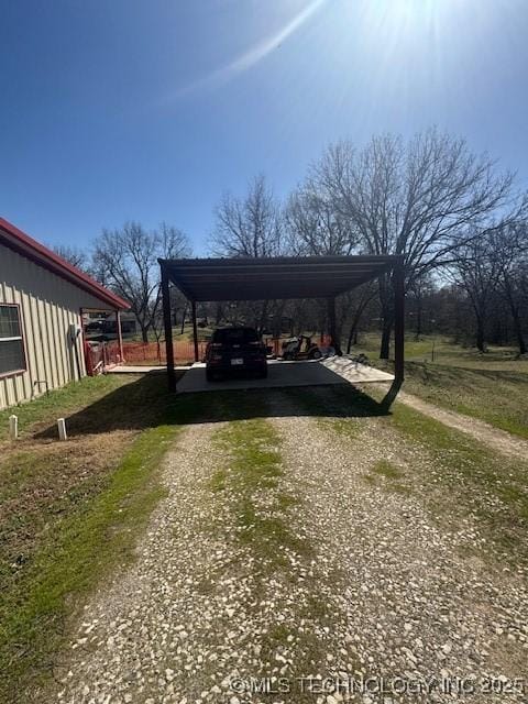 view of car parking featuring driveway and a detached carport