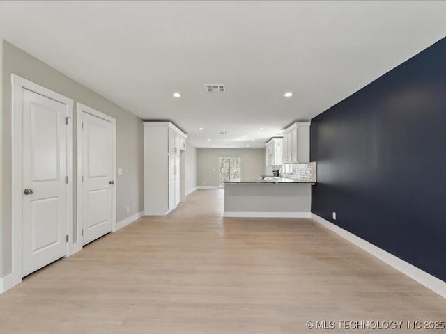 4613 S Linwood Dr, Sand Springs, OK 74063 - unfurnished living room with light wood-style floors, recessed lighting, visible vents, and baseboards