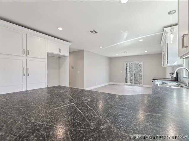 4613 S Linwood Dr, Sand Springs, OK 74063 - kitchen featuring visible vents, dark countertops, white cabinetry, a sink, and recessed lighting