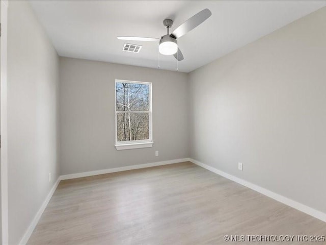 4613 S Linwood Dr, Sand Springs, OK 74063 - spare room featuring a ceiling fan, baseboards, visible vents, and wood finished floors