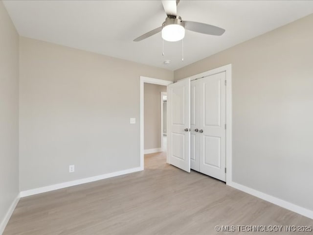 4613 S Linwood Dr, Sand Springs, OK 74063 - unfurnished bedroom featuring a closet, wood finished floors, a ceiling fan, and baseboards