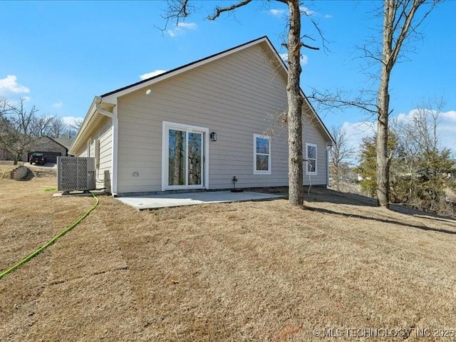 4613 S Linwood Dr, Sand Springs, OK 74063 - back of property featuring central AC, a lawn, and a patio