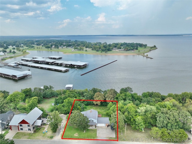 birds eye view of property featuring a water view