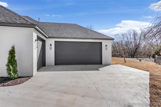 garage featuring driveway