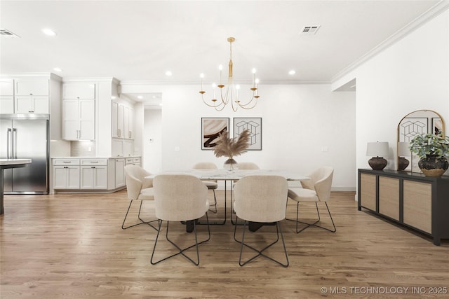 dining room with recessed lighting, visible vents, light wood-style flooring, and crown molding