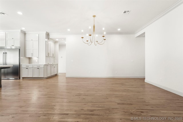 interior space featuring light wood-type flooring, visible vents, and recessed lighting