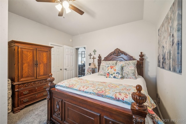 bedroom featuring carpet floors, lofted ceiling, and ceiling fan