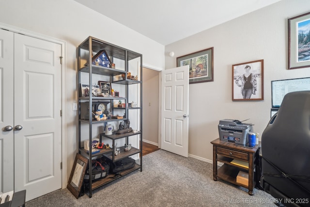 home office with carpet flooring and baseboards