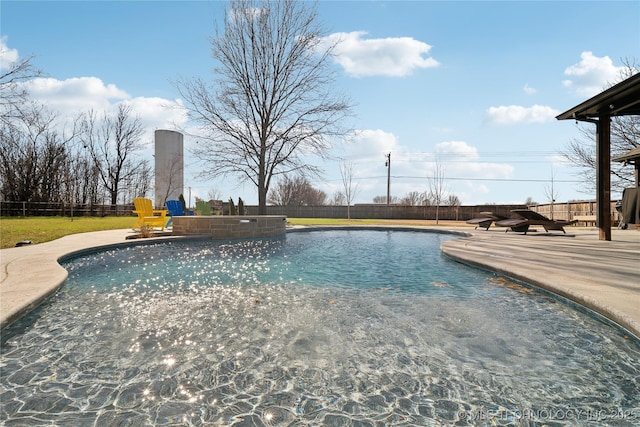 view of pool featuring a fenced backyard, a fenced in pool, and a patio