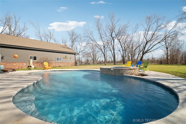 view of swimming pool featuring a patio area, a pool with connected hot tub, fence, and a lawn