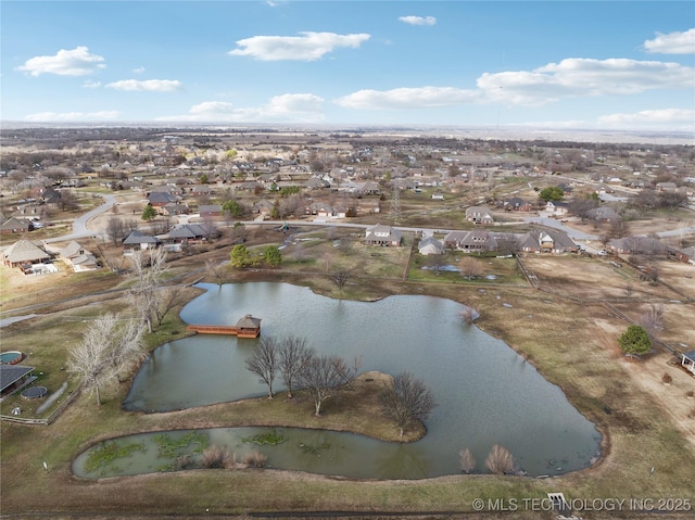 aerial view featuring a water view and a residential view