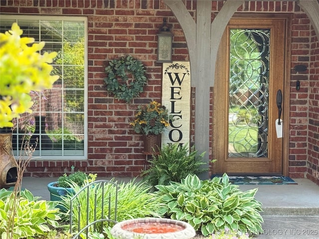 entrance to property with brick siding