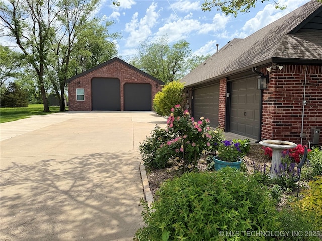view of home's exterior featuring brick siding and roof with shingles