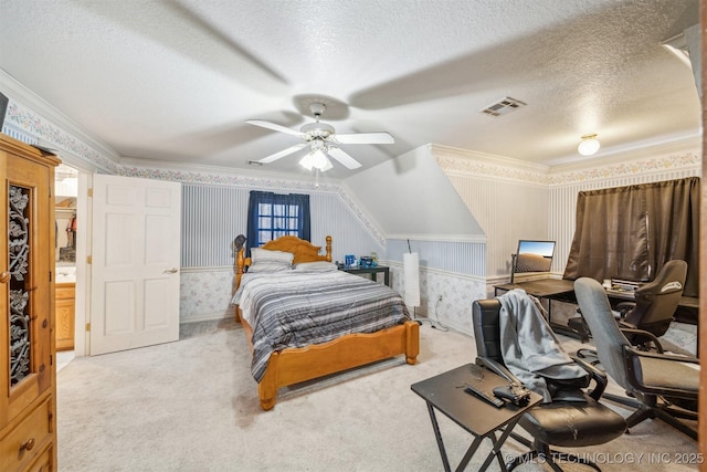 carpeted bedroom featuring wallpapered walls, crown molding, visible vents, and a textured ceiling