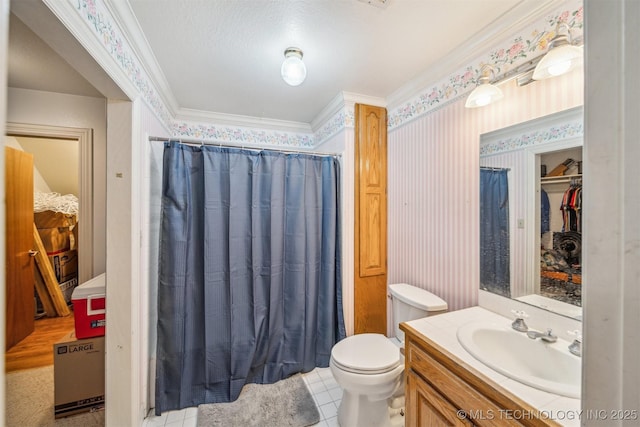 bathroom featuring ornamental molding, vanity, toilet, and wallpapered walls