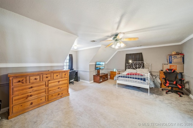 carpeted bedroom with ornamental molding, visible vents, vaulted ceiling, and a textured ceiling