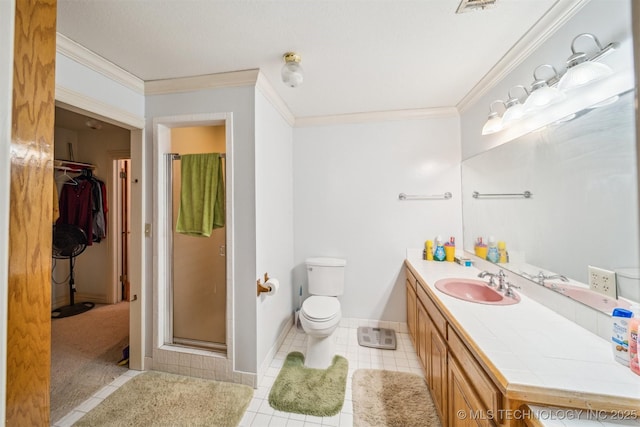 full bath featuring ornamental molding, a stall shower, tile patterned flooring, and vanity