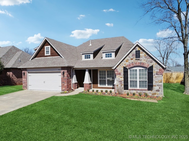 view of front facade featuring a front yard, driveway, roof with shingles, an attached garage, and stone siding