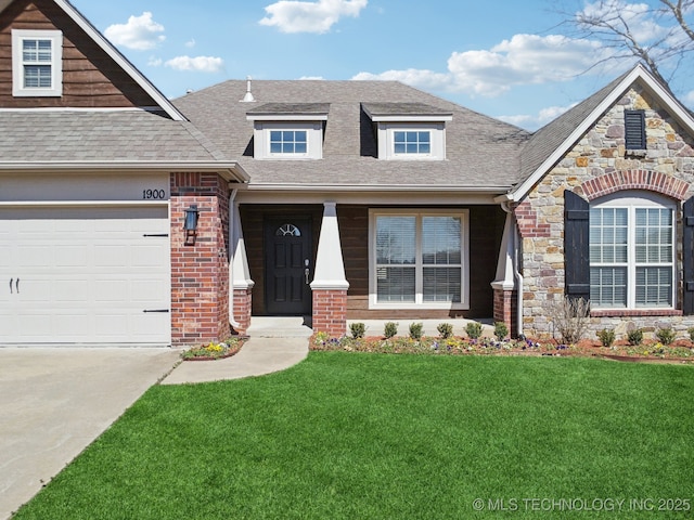 view of front of property featuring an attached garage, brick siding, stone siding, roof with shingles, and a front lawn