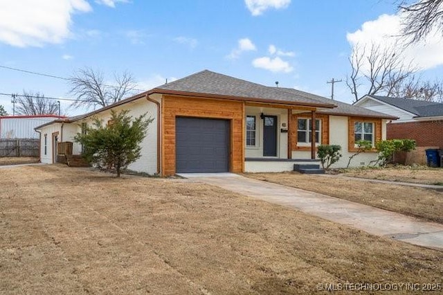 single story home featuring a garage, covered porch, and concrete driveway