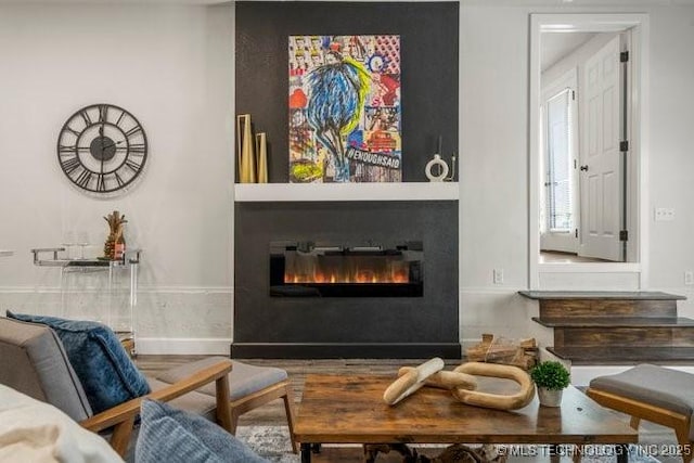 interior space featuring a glass covered fireplace