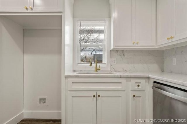 kitchen with white cabinets, dishwasher, backsplash, and a sink