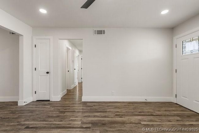 entrance foyer with recessed lighting, dark wood finished floors, and baseboards