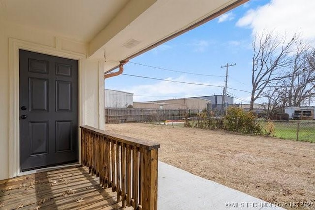 doorway to property with fence