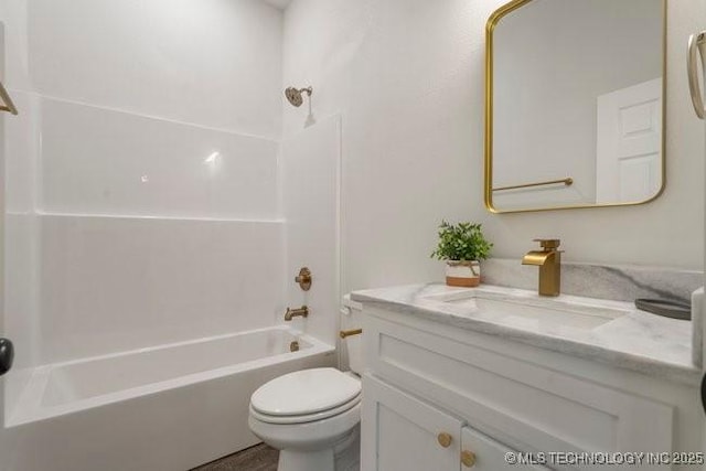 bathroom with toilet, shower / tub combination, and vanity