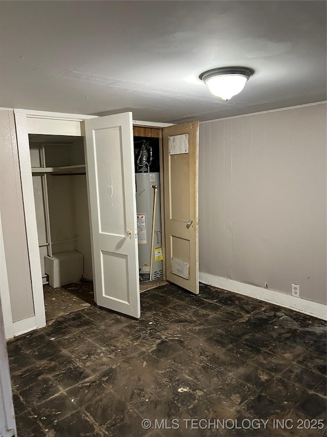 unfurnished bedroom featuring water heater