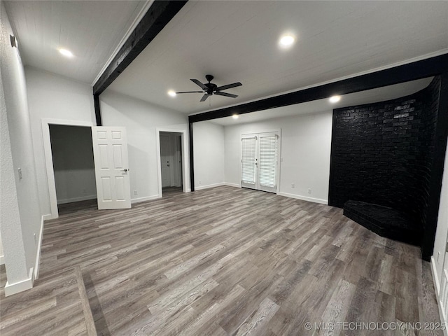 unfurnished living room featuring light wood finished floors, baseboards, lofted ceiling with beams, ceiling fan, and recessed lighting