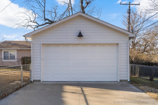 detached garage featuring fence