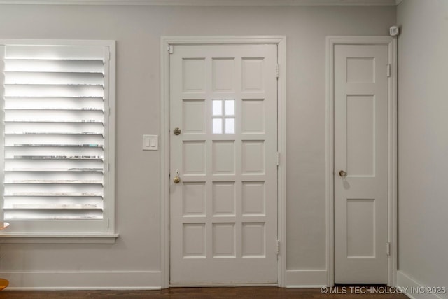 foyer entrance with baseboards