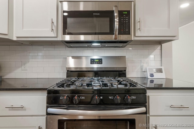 kitchen featuring backsplash, white cabinets, and appliances with stainless steel finishes