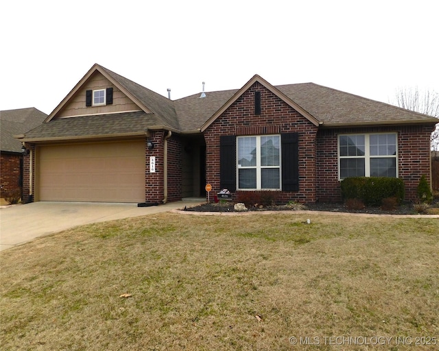 view of front of property featuring a garage, a front yard, concrete driveway, and brick siding