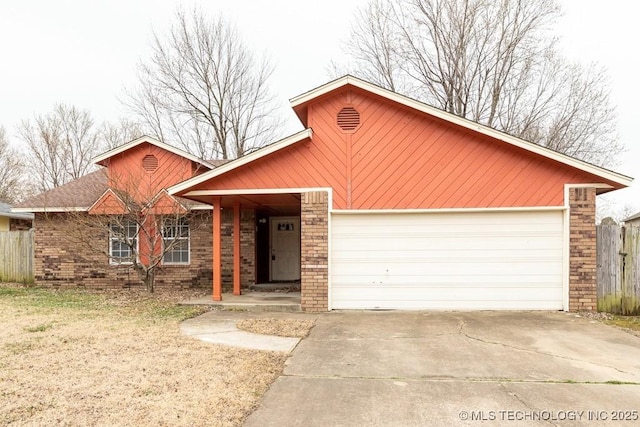 ranch-style house featuring an attached garage, fence, concrete driveway, and brick siding