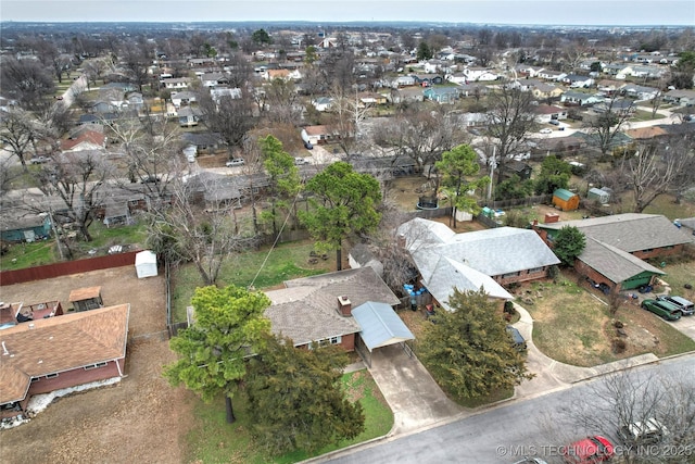 birds eye view of property with a residential view