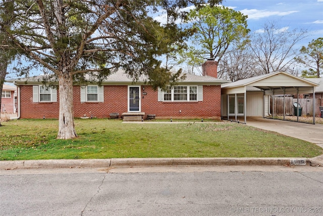 ranch-style house with concrete driveway, brick siding, a chimney, and a front yard