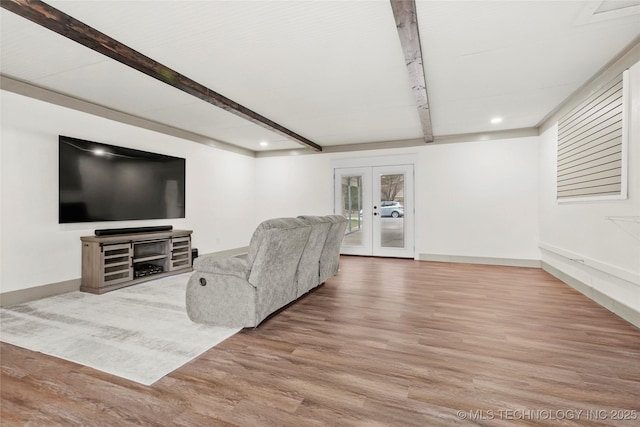 living room featuring baseboards, wood finished floors, french doors, beam ceiling, and recessed lighting