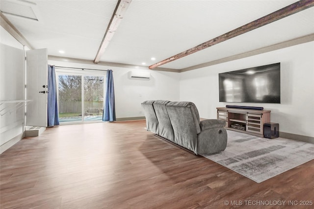 living room featuring an AC wall unit, visible vents, beam ceiling, and wood finished floors