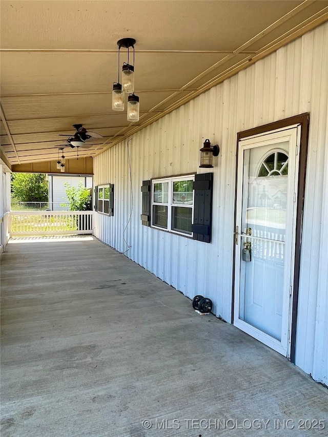 exterior space featuring a porch and a ceiling fan