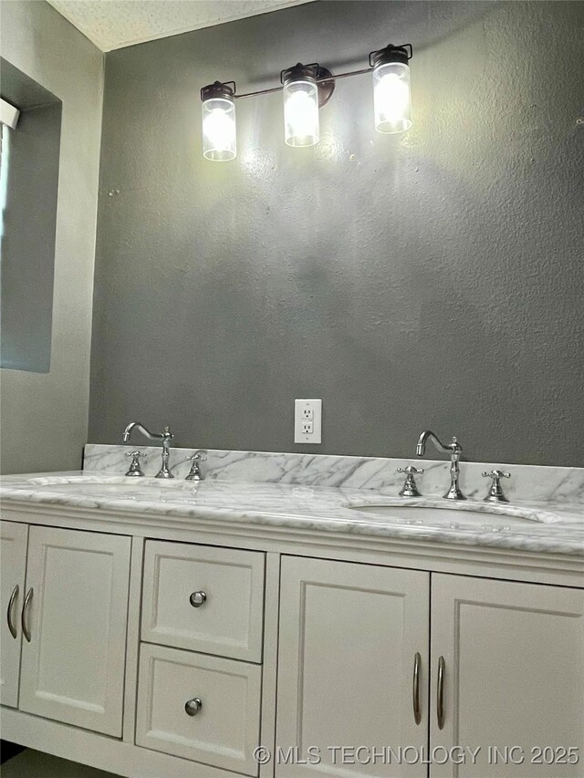 bathroom featuring double vanity and a sink